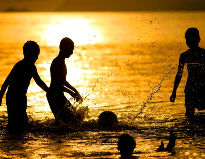 kids on the beach in Zanzibar